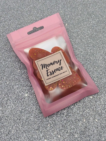 Our Cherry wax melt has a strong, fruity cherry accord with orange interludes and soft notes of red berries.  Please note colours and glitter may vary as each product is handcrafted.  Net weight approx 28g